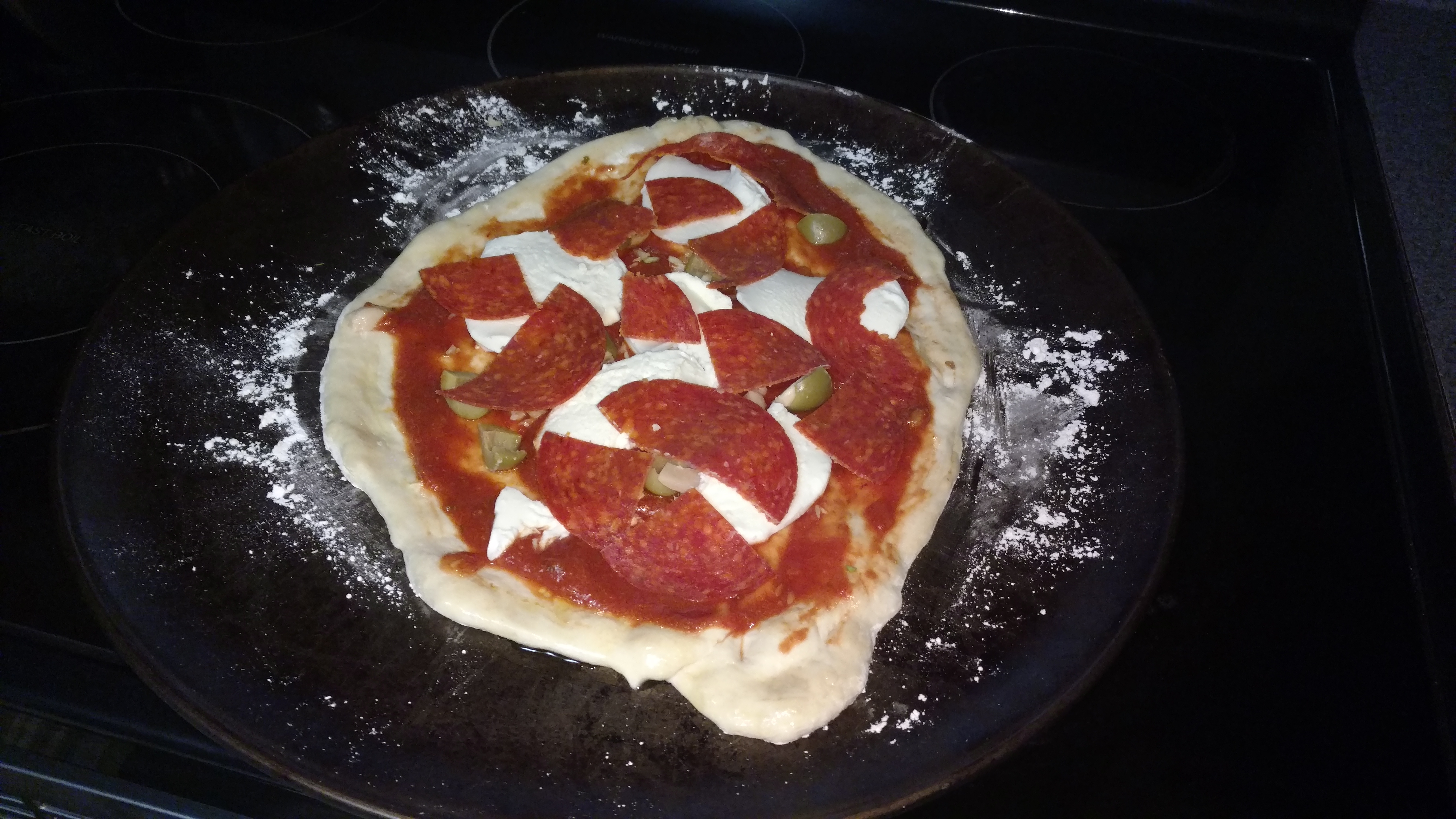 Topped with Fresh Mozz, Pepperoni,  Olives stuffed with garlic, more fresh garlic, Sauce has garlic in it as well.