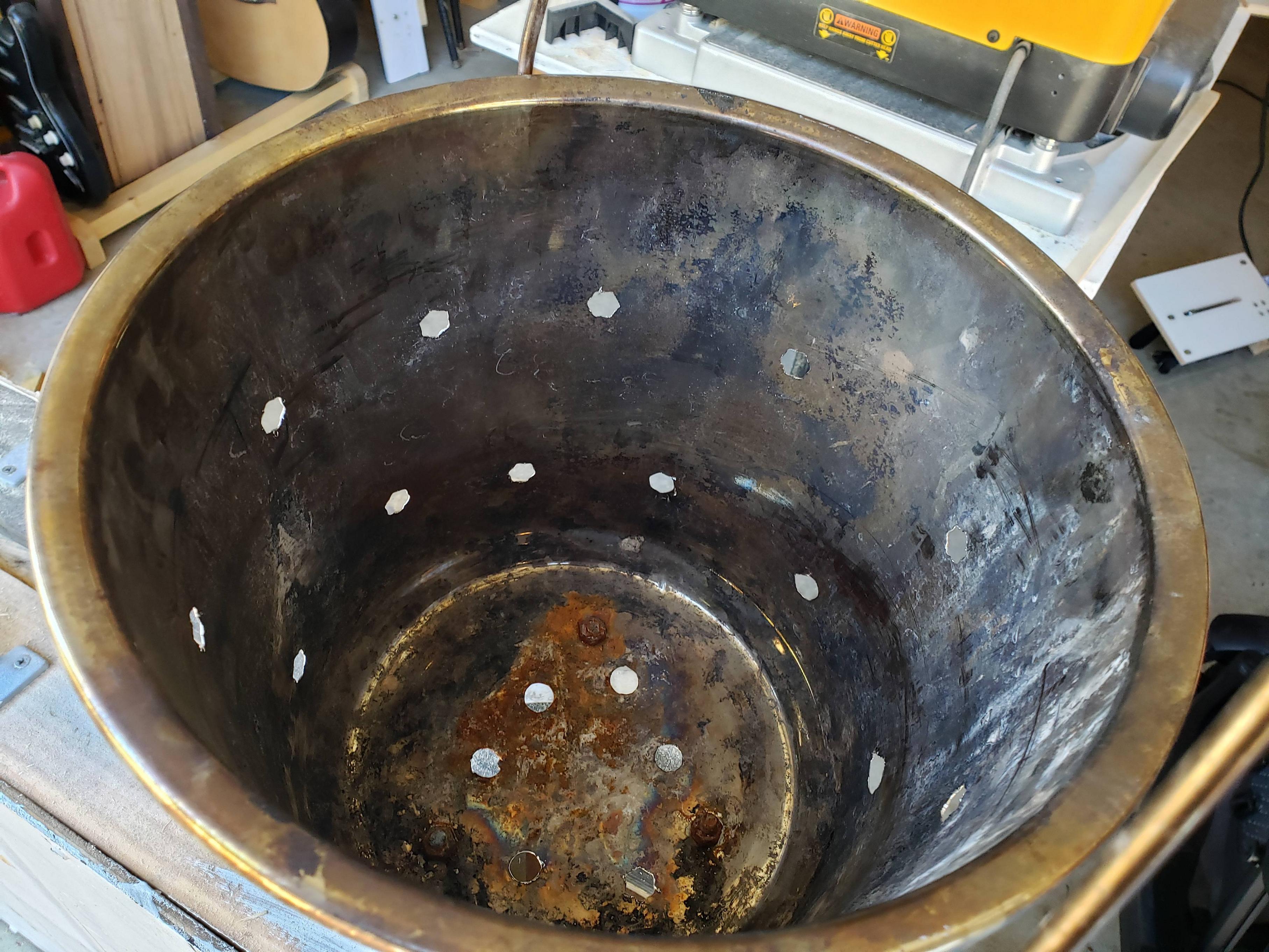 Stainless steel fire basket with drilled holes and legs