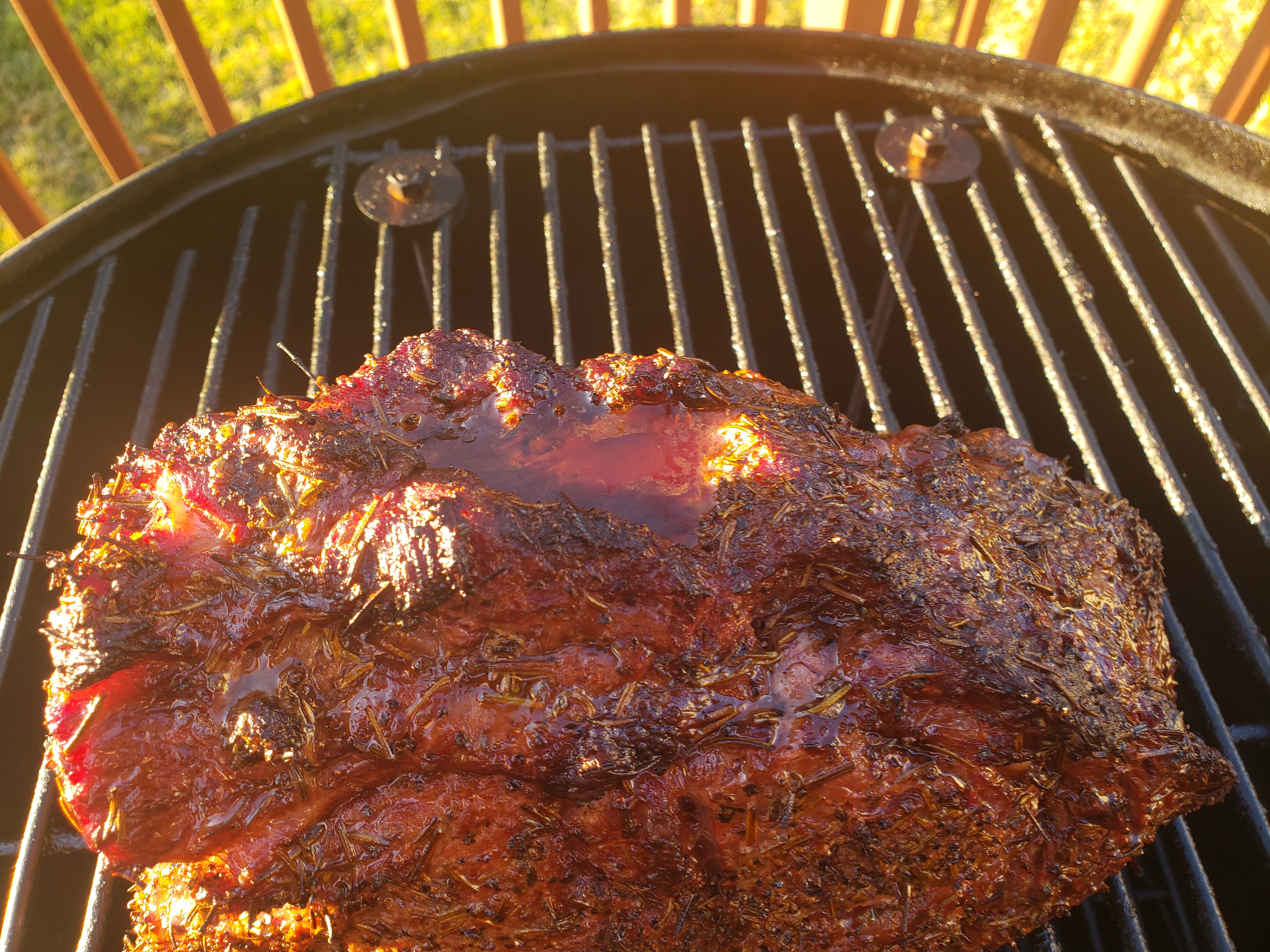 Cooked prime rib with juices resting on top